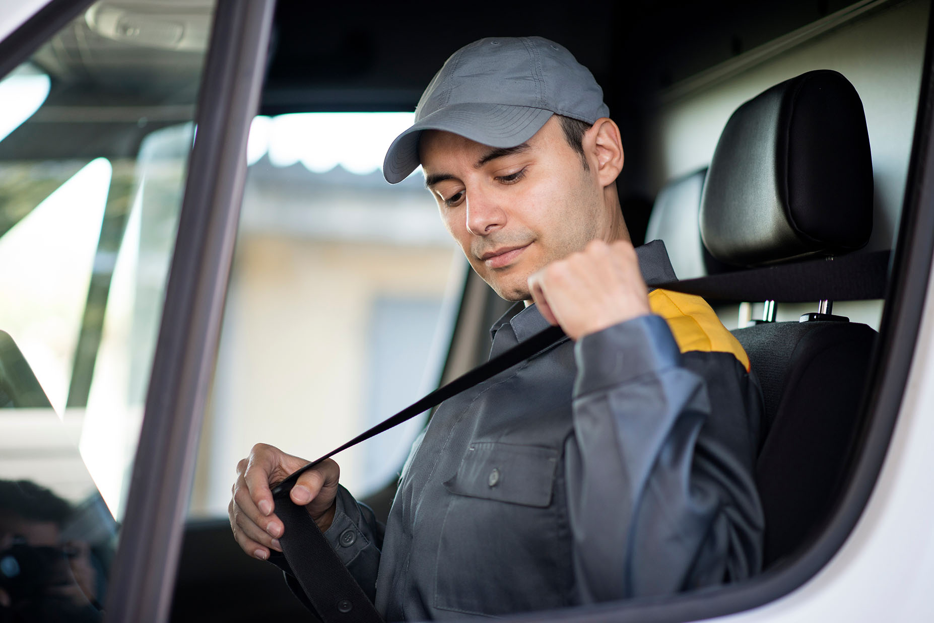 A driver wearing his seat belt