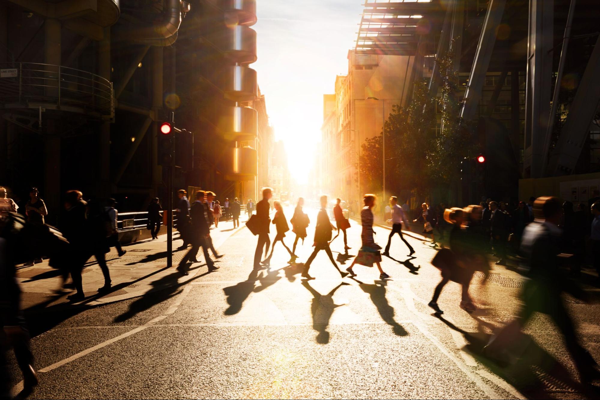 Image of pedestrians crossing a busy street.