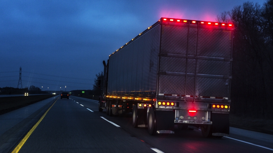 semi truck driving down highway