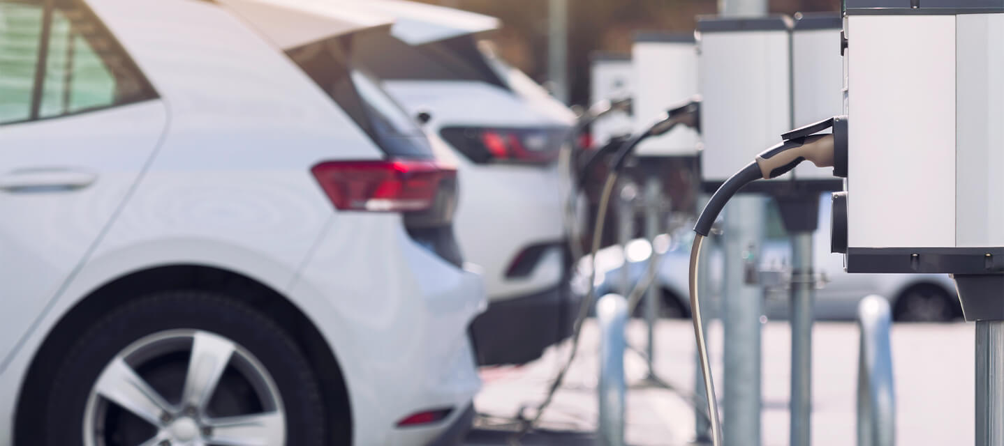 A photo of fleet vehicles charging in a CARB compliant state.