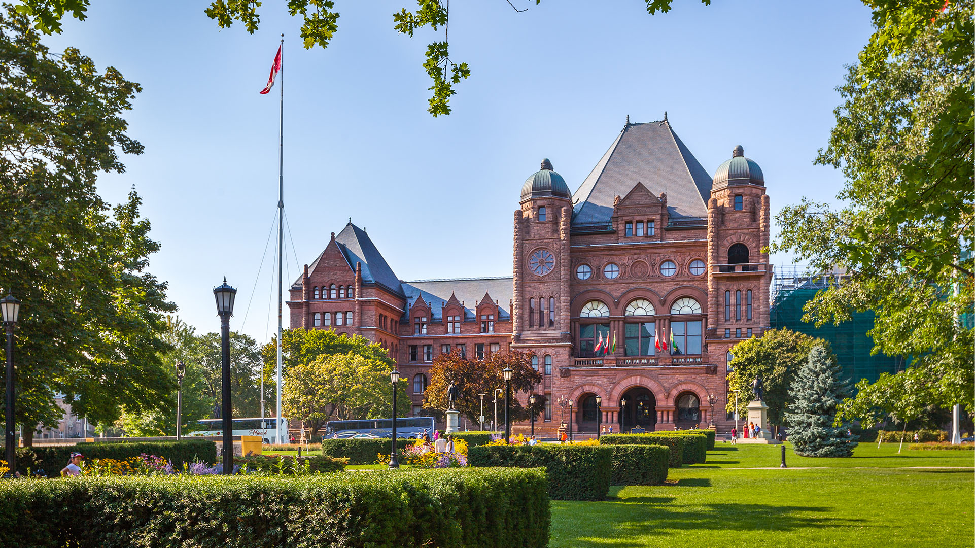 image of a red building with a big garden