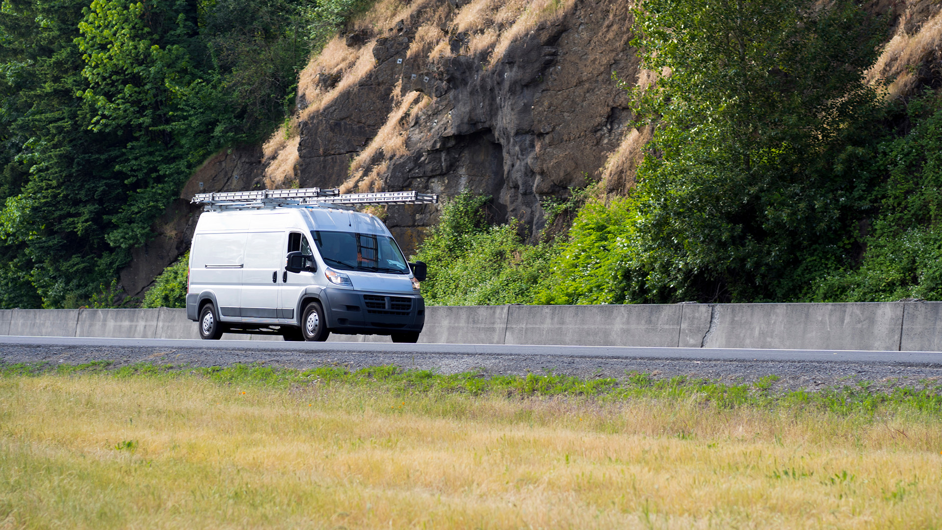 field service van driving on a road