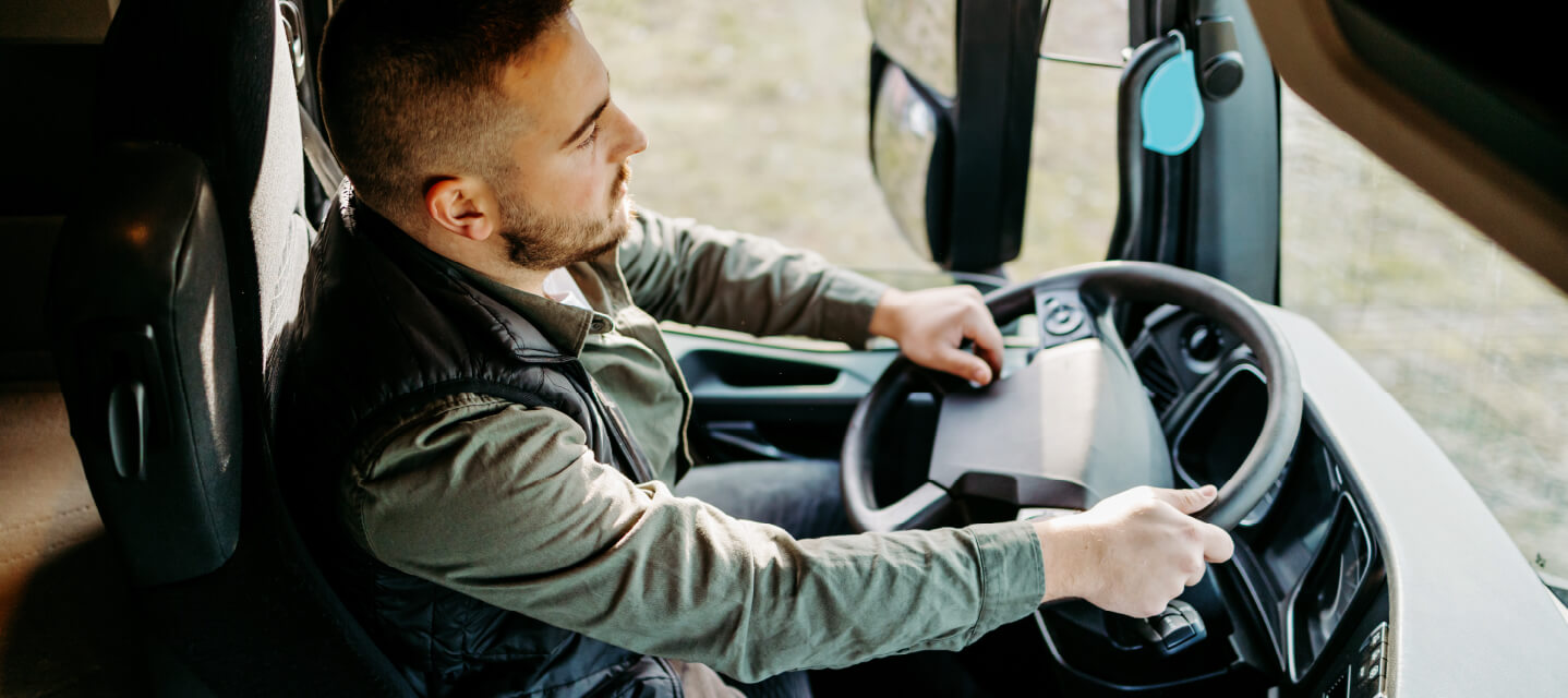 A truck driver using defensive driving tactics for safe driving, not aggressive driving.