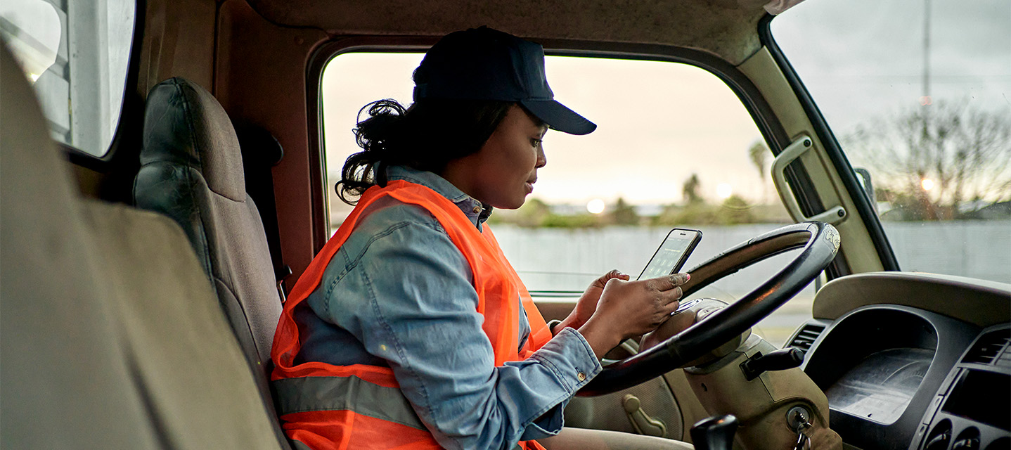 A photo of a fleet driver filling out their IRS mileage log.