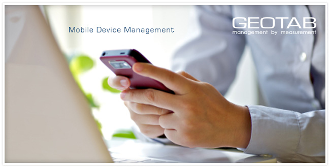 Male on sitting down with smartphone in his hands