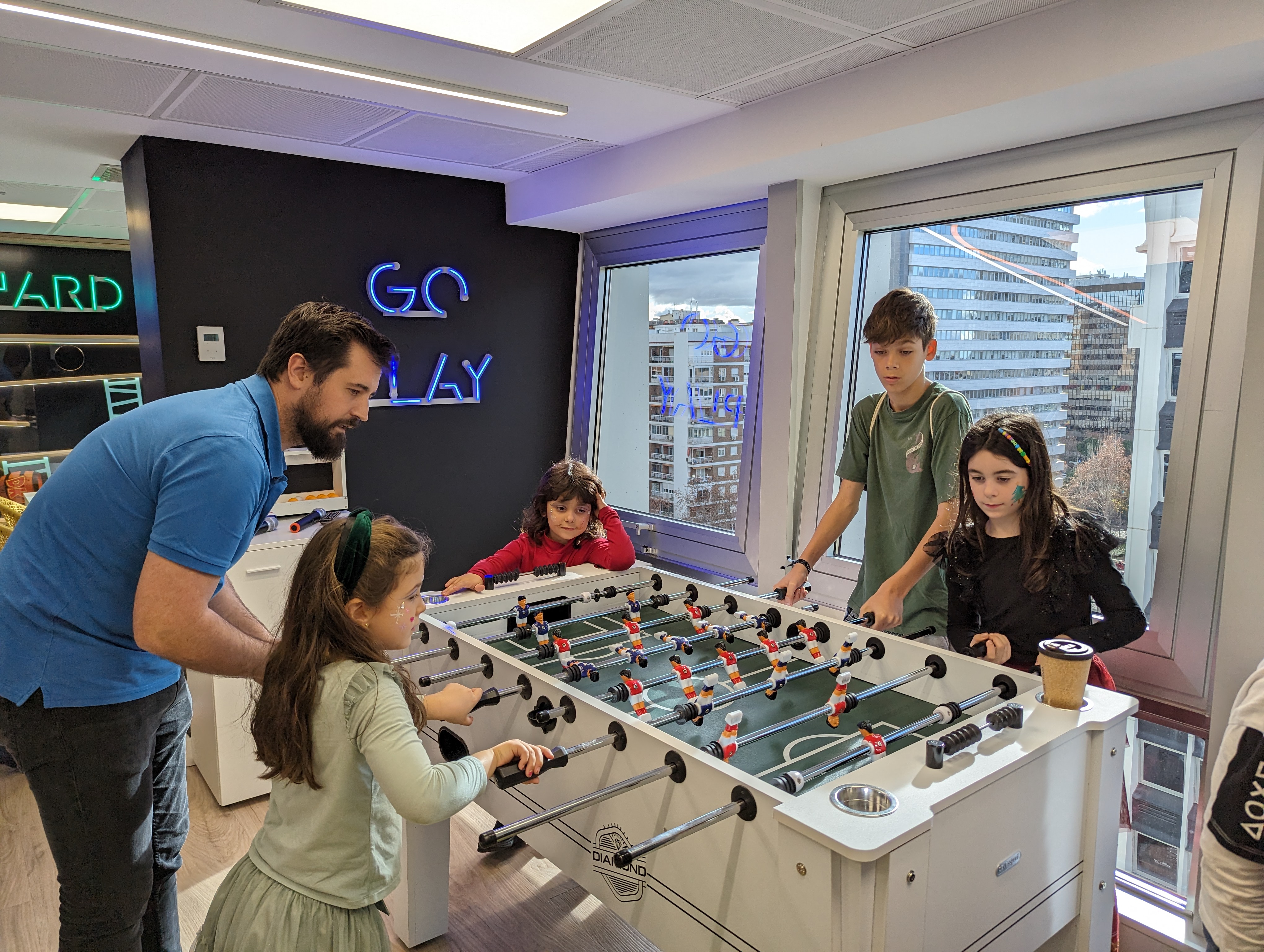 children playing table football with geotabber