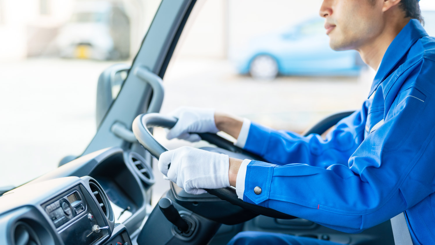 image of a driver driving a vehicle