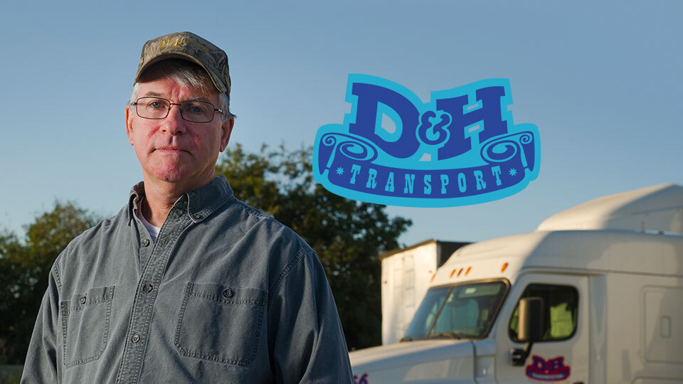 A man standing with a truck