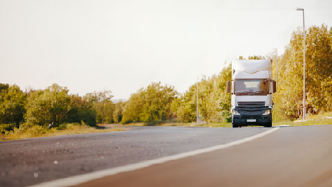 White truck driving on a countryroad
