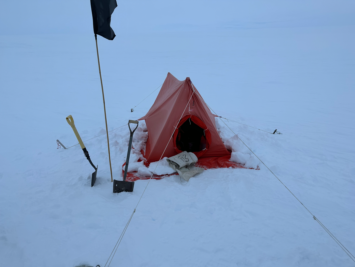 A makeshift toilet in a tent deeply embedded in snow in the Antarctic. 