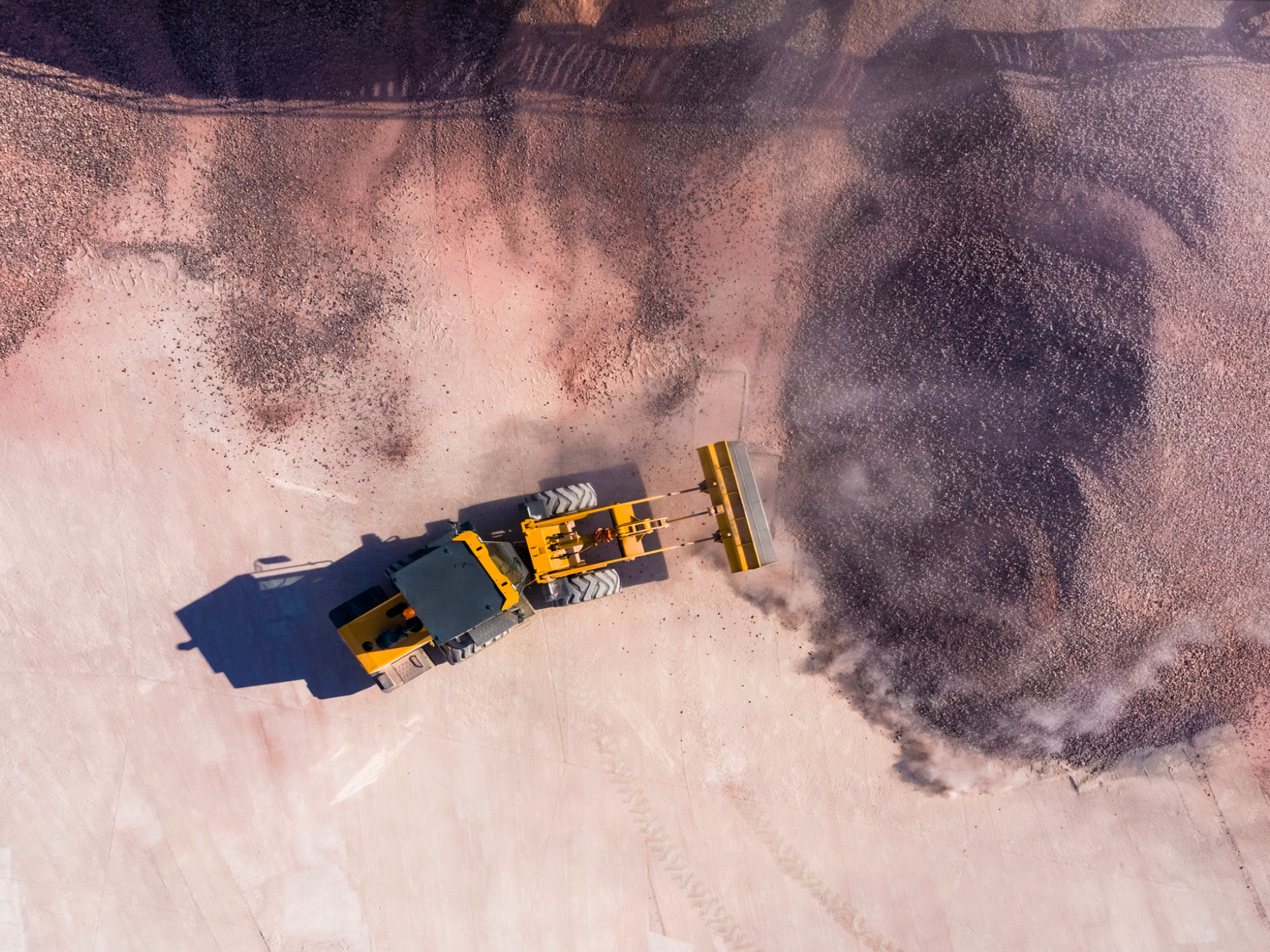 Aerial view of bulldozer moving gravel.