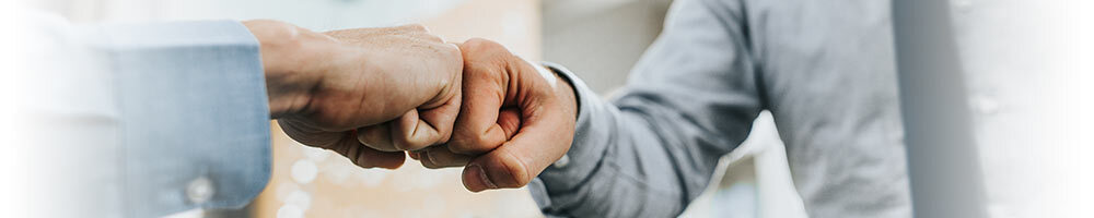 two people doing fist bump