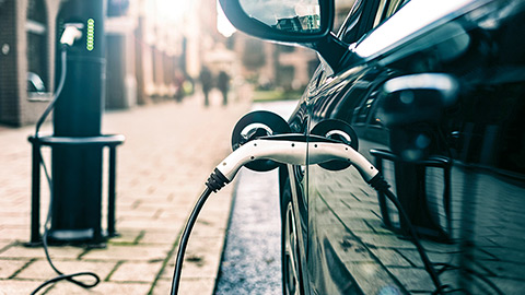 Electric vehicle being charged